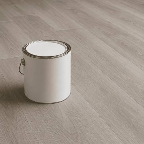 Paint can resting on vinyl flooring