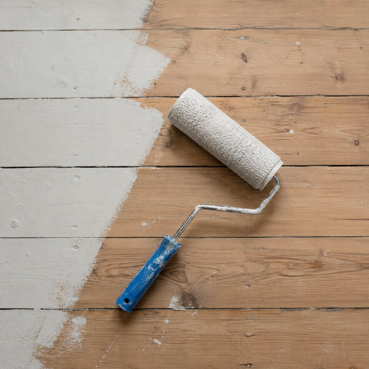 Paint Roller on Wood Flooring